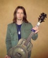 /album/myles-kennedy/myles-with-dean-resonator-jpg/